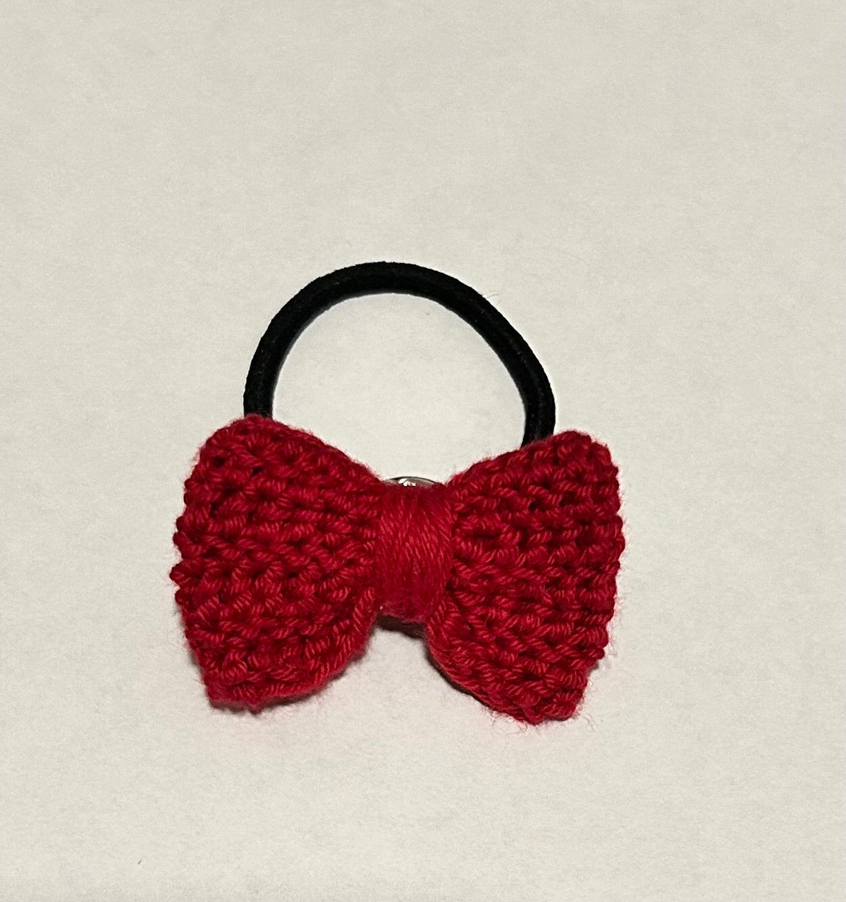 Deep red crochet bow hair tie on elastic